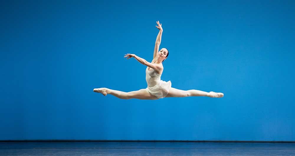 classical ballerina in a grand jété