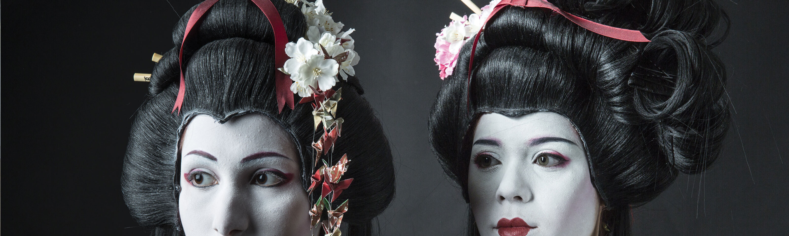 Two models wear geisha-style wigs for a photo shoot